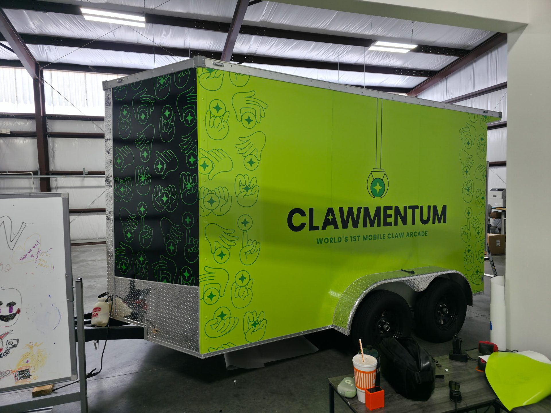 Recently completed enclosed trailer wrap with lime green graphics