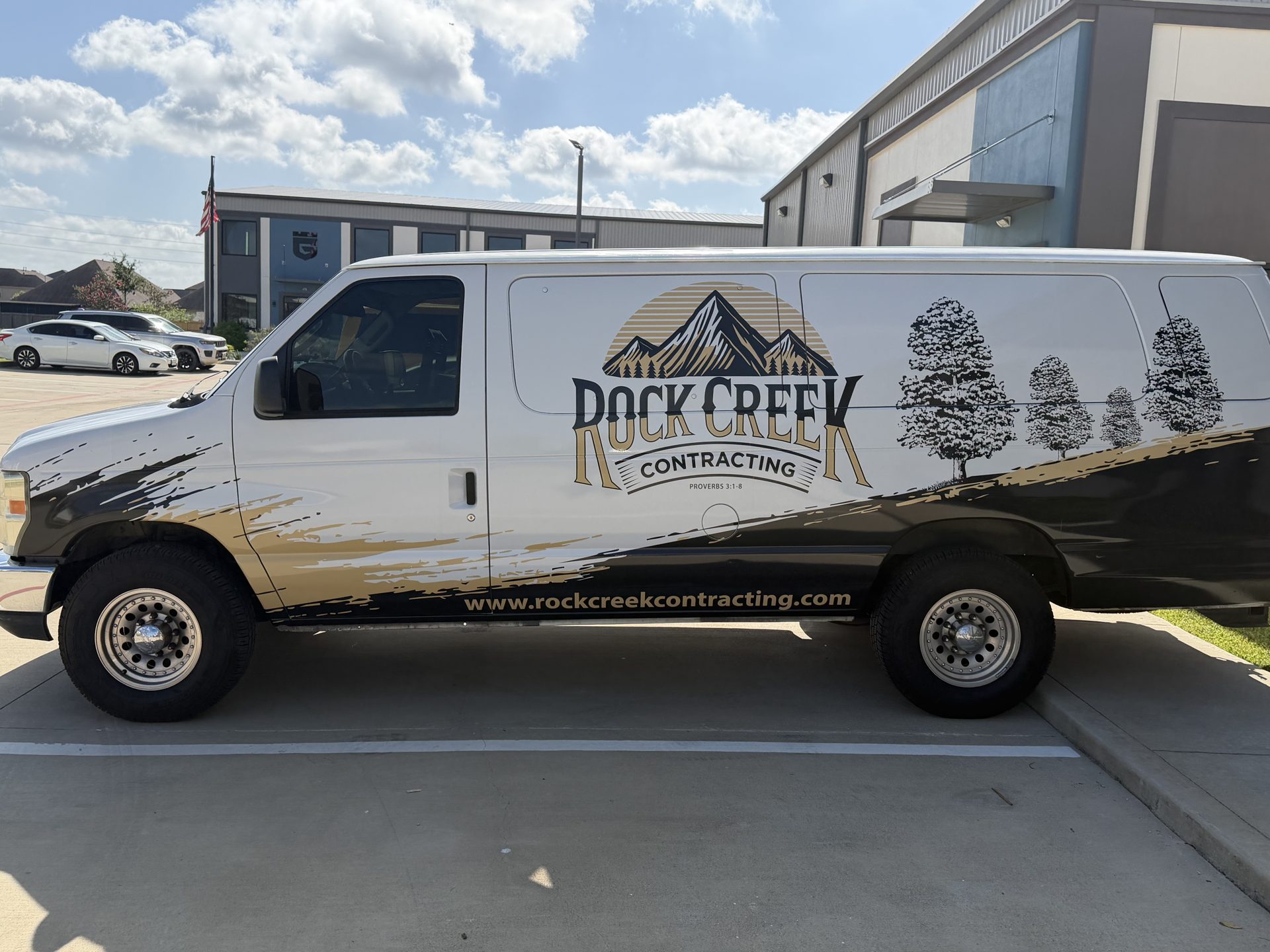 Recently completed commercial van wrap photographed outside the shop